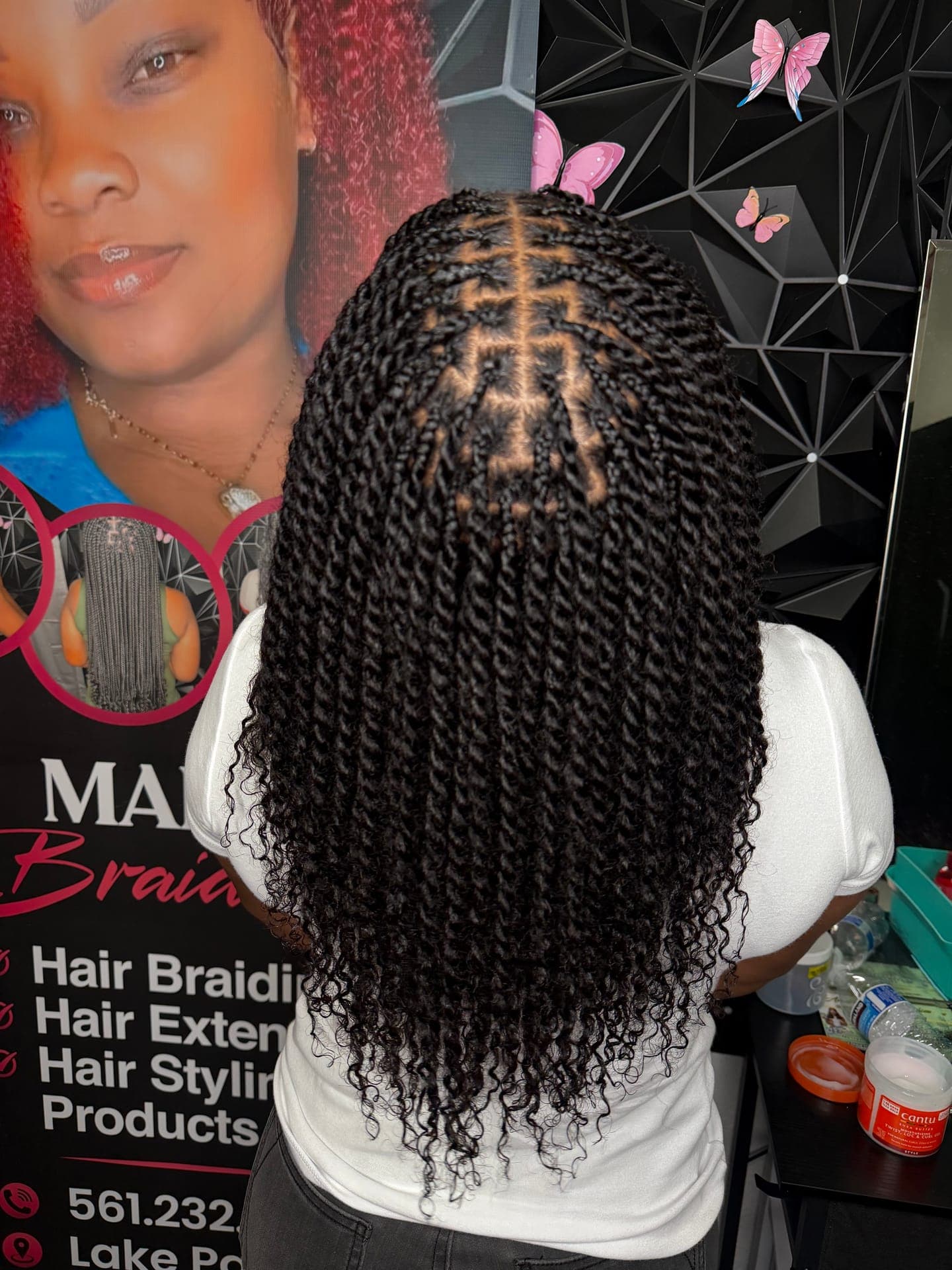 Detailed close-up of box braids with curly ends