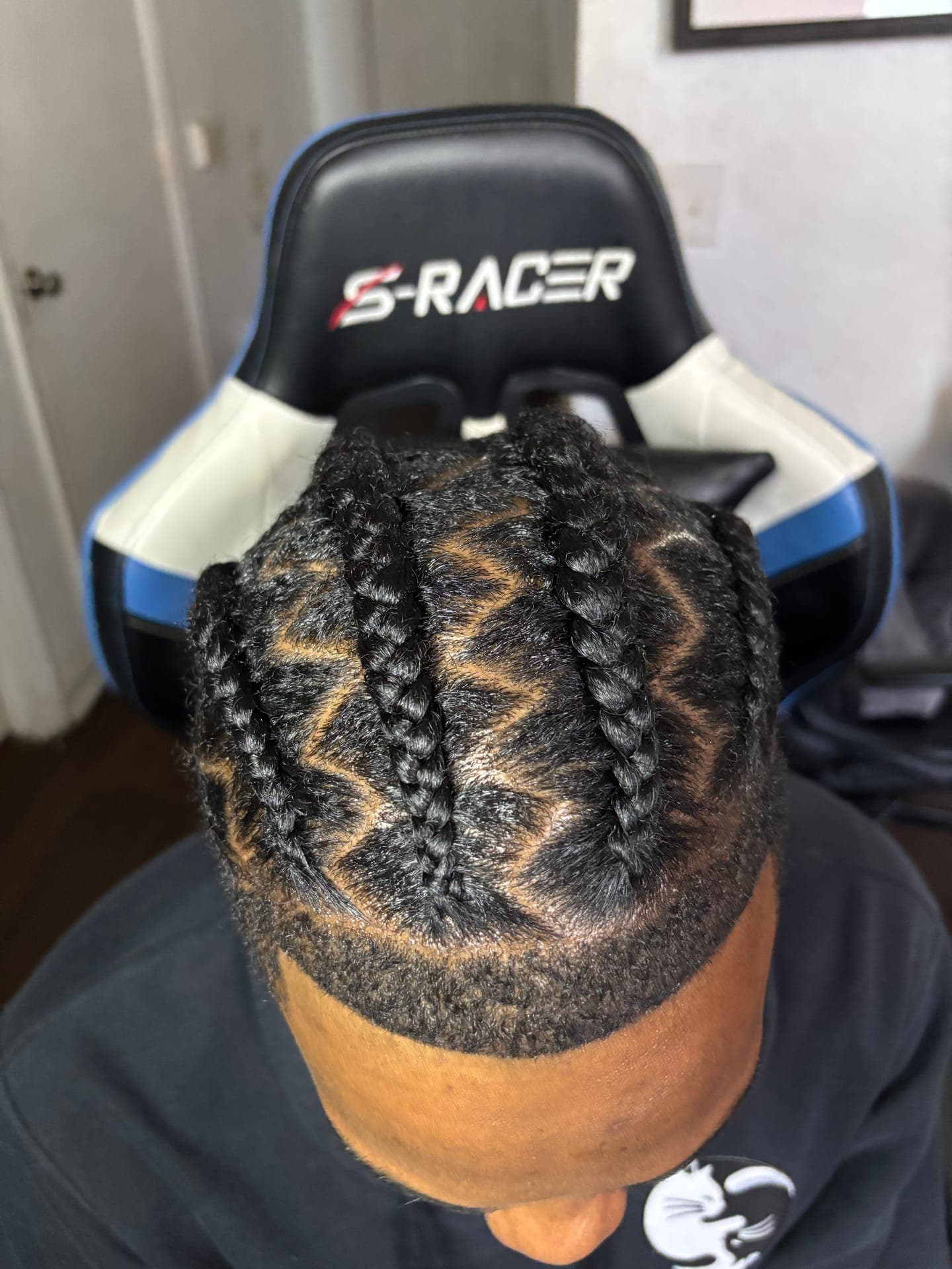 Close-up chevron-pattern cornrows